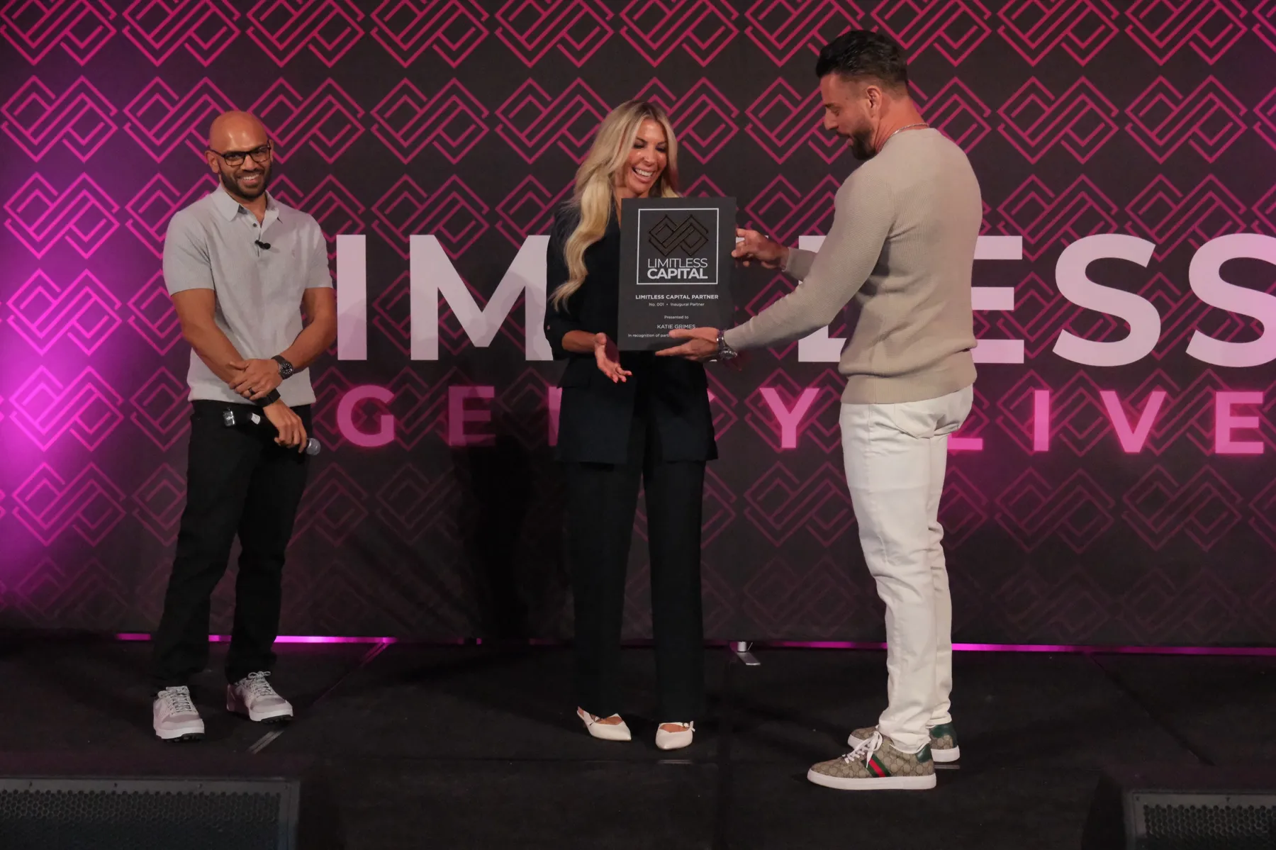 Gill Valerio presenting Katie Grimes the first Limitless Capital Partner award